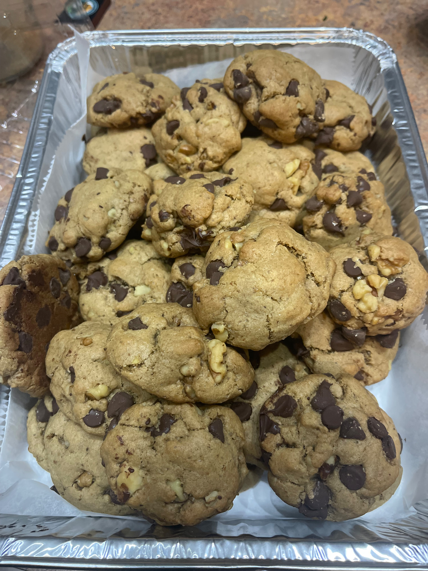 Nutty chocolate chip cookies packed in a pan